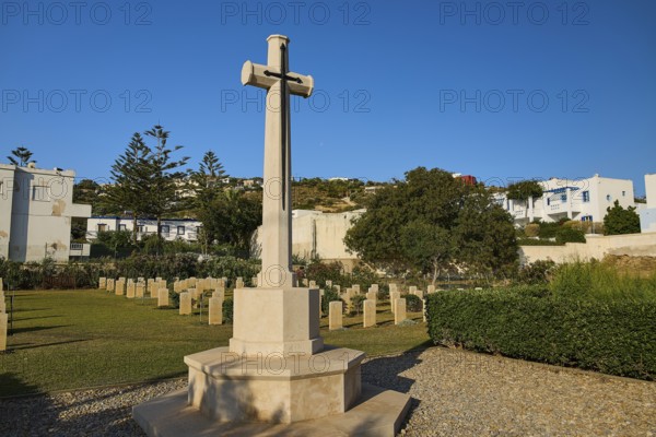 Large cross on a cemetery with surrounding buildings and trees, Military cemetery, Commonwealth War Cemetery, Military cemetery, WW2, 1939-1945, 179 graves, Alinda, Leros, Dodecanese, Greek Islands, Greece