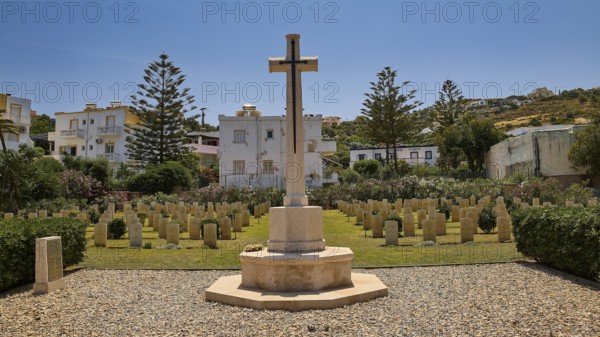 Large cross on a cemetery surrounded by gravestones and trees, Military Cemetery, Commonwealth War Cemetery, WW2, 1939-1945, 179 graves, Alinda, Leros, Dodecanese, Greek Islands, Greece