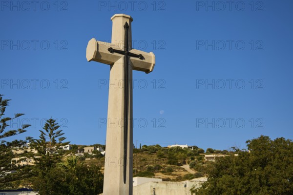 Large cross in front of blue sky with moon, landscape in the background, military cemetery, Commonwealth War Cemetery, WW2, 1939-1945, 179 graves, Alinda, Leros, Dodecanese, Greek Islands, Greece