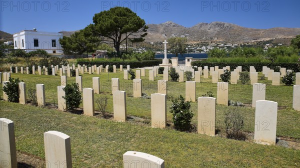 Cemetery with gravestones and sea view, surrounded by trees and mountains, Military Cemetery, Commonwealth War Cemetery, Military Cemetery, WW2, 1939-1945, 179 graves, Alinda, Leros, Dodecanese, Greek Islands, Greece