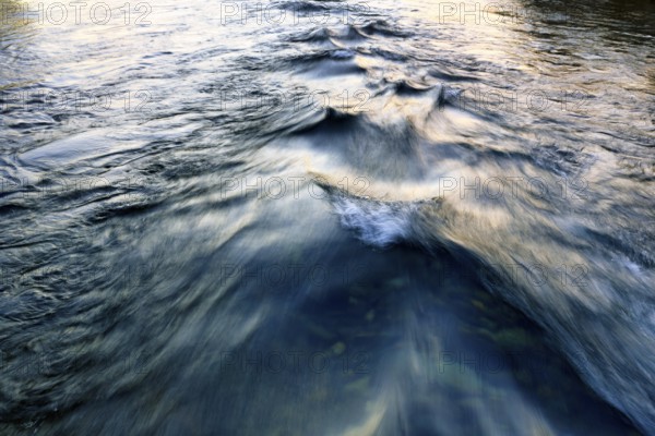 Waves in the river, river landscape, evening sun, motion blur, text free space, Iceland