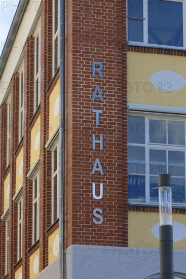 New town hall in the former Kindler corset factory, former Gotthold Kindler and Cie. corset factory, factory building, former textile industry, brick, building, lettering, letters, street light, Gomaringen, district of Tübingen, Baden-Württemberg, Germany