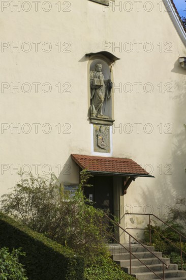 Chapel of St Wolfgang Oberuhldingen, built in 1711, stone figure of St Wolfgang depicted as a Benedictine monk with crosier and mitre, coat of arms unicorn and pelican, statue, relief, district of Oberuhldingen, municipality of Uhldingen-Mühlhofen, Lake Constance district, Baden-Württemberg, Germany