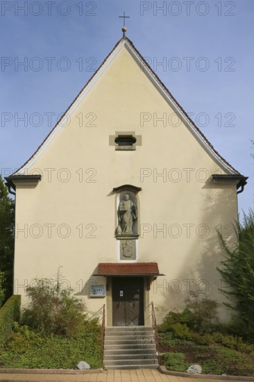 Chapel of St Wolfgang Oberuhldingen, built in 1711, stone figure of St Wolfgang depicted as a Benedictine monk with crosier and mitre, coat of arms unicorn and pelican, statue, cross, sacred building, relief, district of Oberuhldingen, municipality of Uhldingen-Mühlhofen, Lake Constance district, Baden-Württemberg, Germany