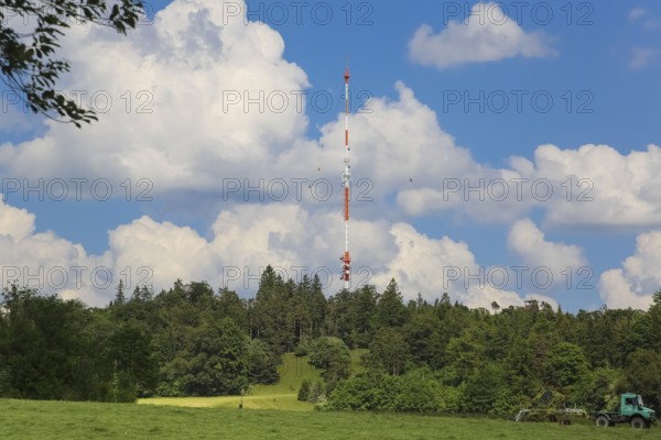 Raichberg transmitter, clouds, trees, basic network transmitter of the Südwestrundfunk for radio and television, antenna support 137 metres, tubular steel mast on the Raichberg, Onstmettingen district, Zollernalbkreis, Baden-Württemberg, Germany