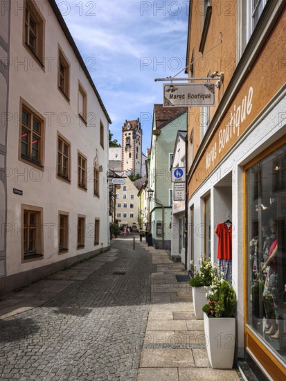 Everyday downtown scene in Hutergasse in the historic old town of Füssen im Allgäu, Bavaria, Germany, for editorial use only