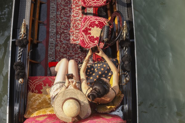 Women in a gondola, Venice, Italy