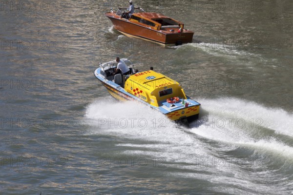 Ambulance boat in action on the Grand Canal, Rialto, Venice, Veneto, Italy