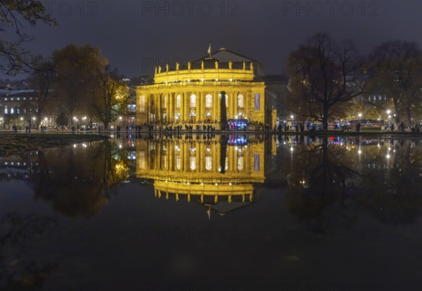 The Stuttgart Opera House is reflected in Eckensee in the evening. Stuttgart, Baden-Württemberg, Germany
