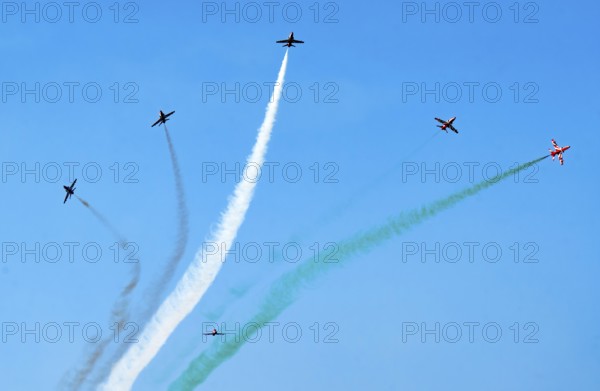 The Indian Air Force (IAF) Surya Kiran aerobatics team performs during an air show as part of the 93rd Air Force Day celebrations on November 8, 2025 in Guwahati, India