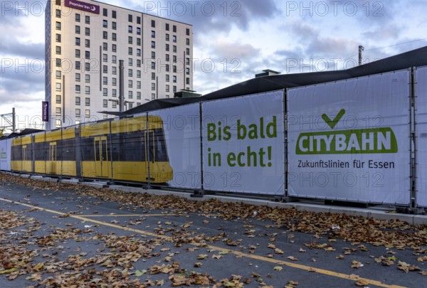 Construction site of the stop at the main train station, for the new city railway, visualization of the full-size tram, a new tram line over 5 km long, which will connect the west of Essen, the new district 51, with the city center, from 2026, Essen, North Rhine-Westphalia, Germany