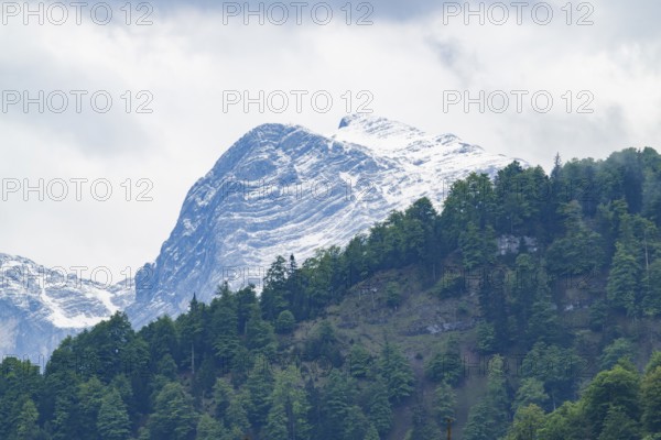 View into the mountains next to Lake Almsee on a rainy day in spring, Traunstein summit, Traunkirchen, Salzkammergut, Austria