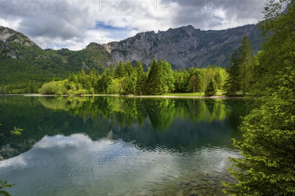 Landscape of Lake Offensee after rain when the sun comes through the clouds in spring, Salzkammergut, Austria