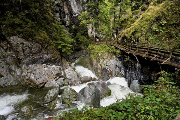 Wooden walkway on the Diosaz mountain river in the gorge, Gorges de la Diosaz, Les Houches, Chamonix-Mont-Blanc, Haute-Savoie, France