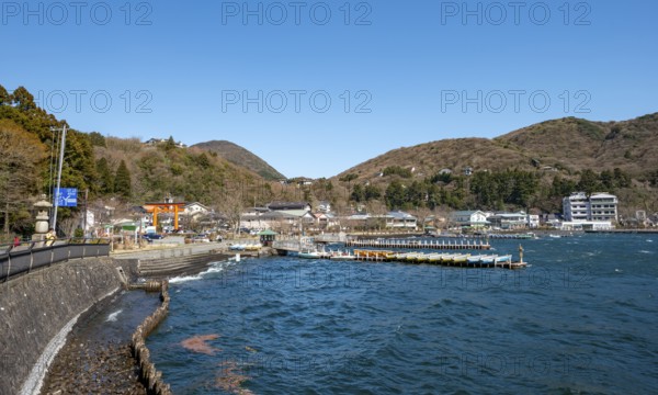 View of bay with boat docks, Motohakone town, Hakone, Japan