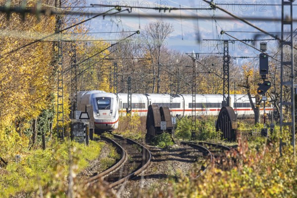 Intercity Express ICE. Open-route passenger train in the Stuttgart North Station area. Arched bridge and landscape in autumn. Stuttgart, Baden-Württemberg, Germany