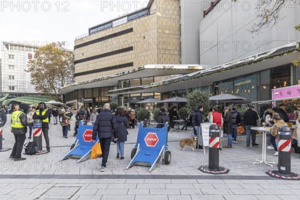In the run-up to Christmas, the cityscape is characterized by terrorist blockages. Drive-through barriers secure the city center when there are many people on roads and squares due to events. Dorotheen Quartier in Stuttgart, Baden-Württemberg, Germany