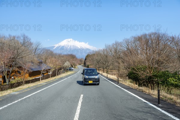 Car on road, road leads to Mount Fuji volcano, wanderlust, Yamanashi Prefecture, Japan