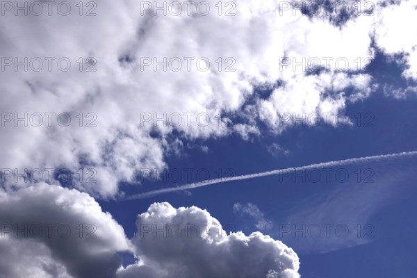 Cloudy sky with contrails, Germany