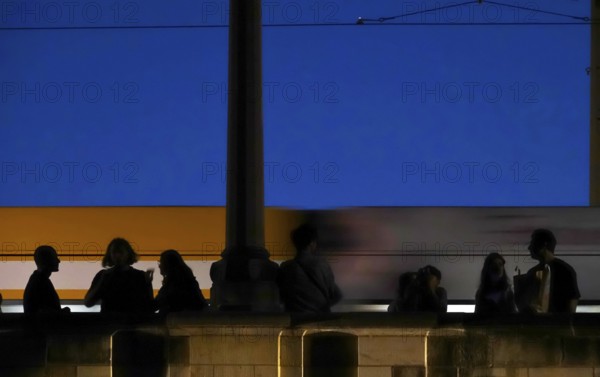 Tourists in Dresden on a bridge in the evening, Saxony, Germany