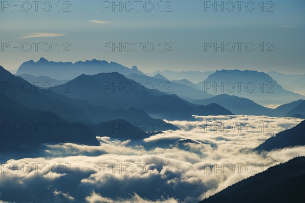 Blue-colored silhouette of mountains, fog in the valley, Wilder Kaiser and Chiemgau Alps, Upper Bavaria, Bavaria, Germany