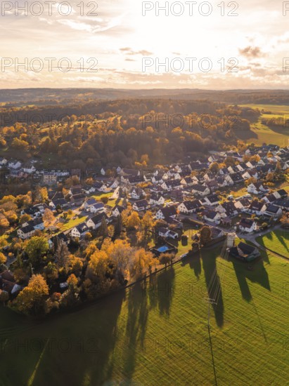 Idyllic village in autumn light with many houses and surrounding fields, surrounded by forests, Lehenweiler, Aidlingen, Böblingen district, Germany