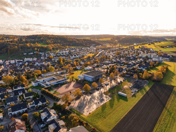 A vast village in an autumnal landscape with fields, Aidlingen, Böblingen district, Germany
