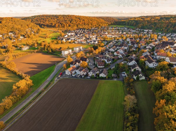 Autumn scenery of a village near fields and forests at sunset, Aidlingen, Böblingen district, Germany