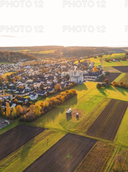 Bird's eye view of settlement and fields, autumn colors in evening light, Aidlingen, Böblingen district, Germany