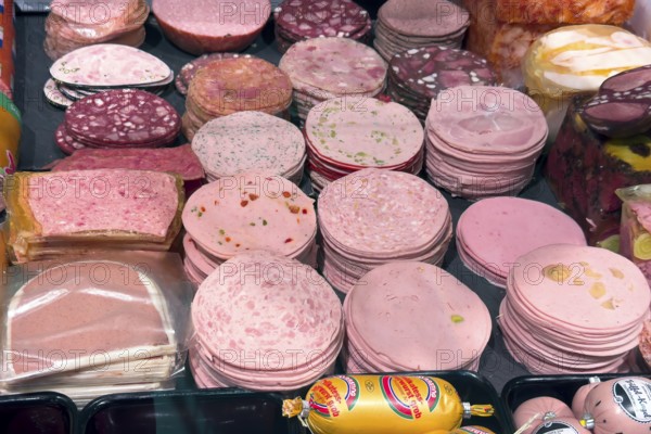 Many different types of sausage types of sausages sliced sausage cold cuts sausage slices of boiled sausage fresh sausage Lyoner mortadella sausages Sülzwurst blood sausage beer ham in sausage counter from retail retailers, Germany