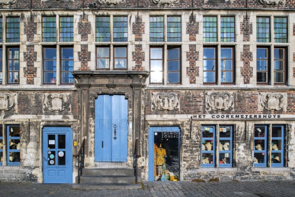 Façade of 17th century baroque guildhall Korenmetershuis at the Graslei in the city Ghent, East Flanders, Belgium