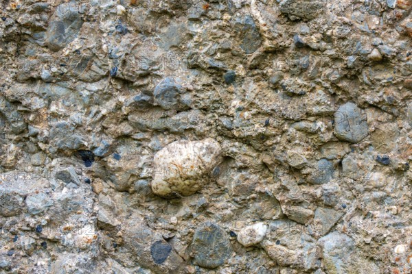 Close-up of conglomerate rock of menhir, standing stone showing clasts and matrix at Wéris, Luxembourg, Belgian Ardennes, Wallonia, Belgium