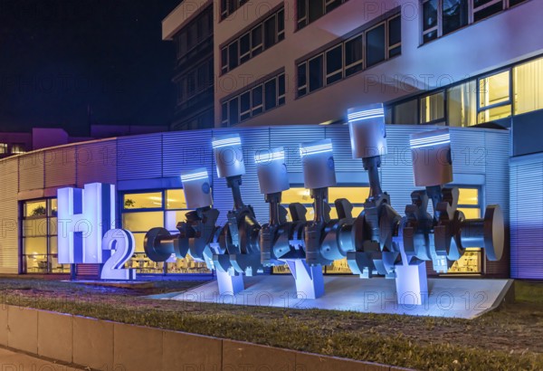 Automotive supplier Mahle. The piston shaft in front of the head office was supplemented by an H2 oil sculpture. It represents the company's expertise in the research and development of fuel cells. Stuttgart, Baden-Württemberg, Germany