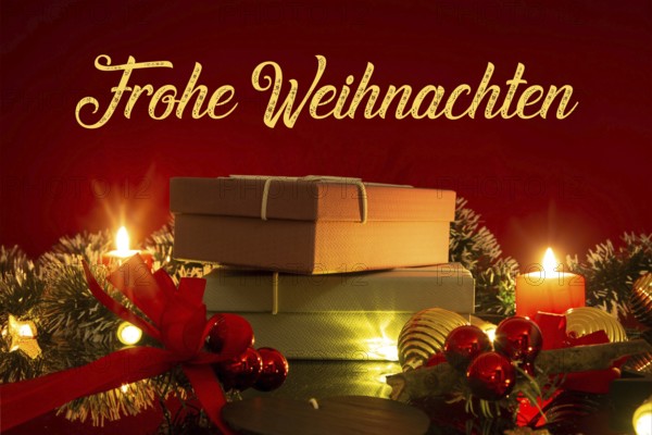 Christmas greetings: table with Christmas decoration and gifts against a red background with inserted lettering MERRY CHRISTMAS