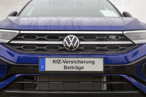 (photo montage) Close-up of a license plate with text Car insurance CONTRIBUTIONS