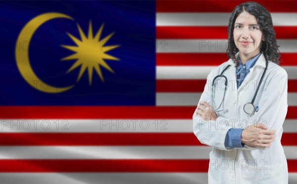 Malaysian medicine and healthcare concept. Close up of doctor against Malaysia flag background