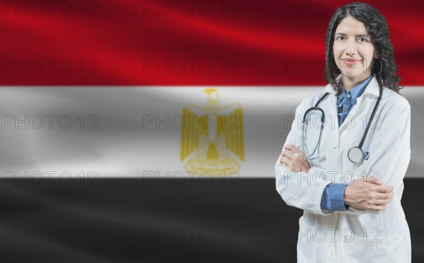 Egyptian medicine and healthcare concept. Close up of doctor against Egypt flag background