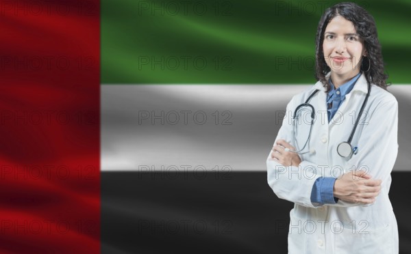 Emirati medicine and healthcare concept. Close up of doctor against United Arab Emirates flag background
