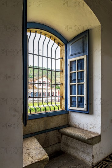 Window inside a Baroque church overlooking the historic city of Ouro Preto in Minas Gerais, Ouro Preto, Minas Gerais, Brazil