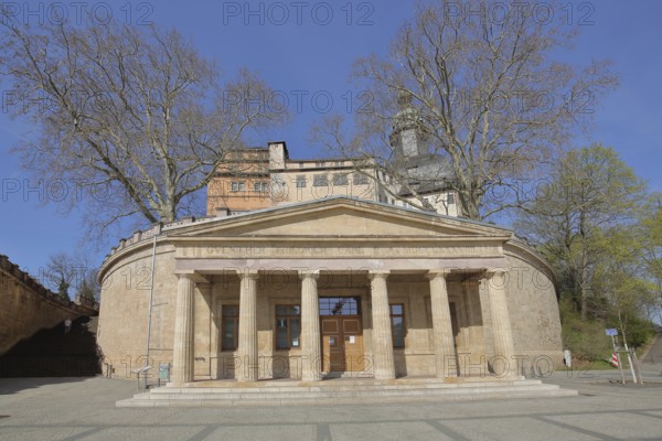 Old guard and tourist information office with arcade on the market square with castle on the mountain, Sondershausen, Thuringia, Germany