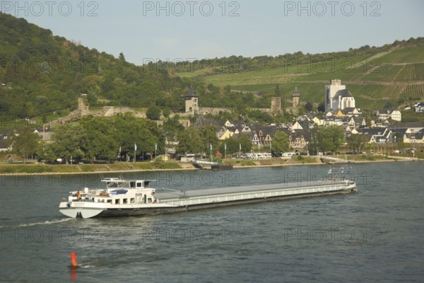 Cityscape with city fortifications and towers of Oberwesel on the Rhine with cargo ship, Rhineland-Palatinate, UNESCO, Upper Middle Rhine Valley, Germany