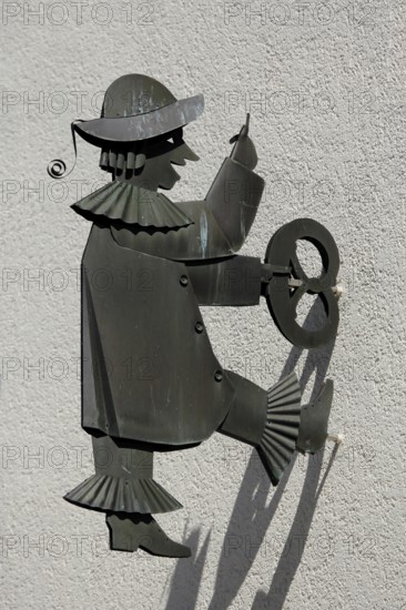 Figure Kasperl by Max and Moritz, sculpture, puppet, pretzel, holding, climbing, shadow, up, walking, moving, black, vertical, high, shadow play, Fischbrunnenstraße, Esslingen, Baden-Württemberg, Germany