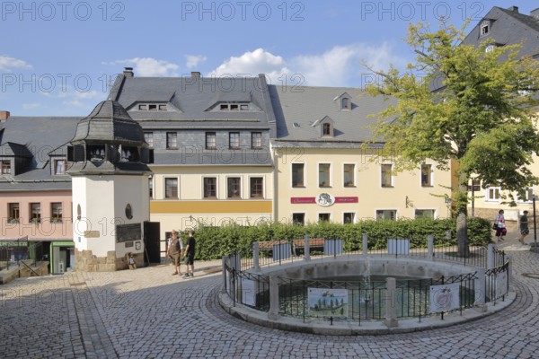 Historic bell tower with carillon and ornamental fountain, turrets, houses, Schwarzenberg, Western Ore Mountains, Ore Mountains, Saxony, Germany