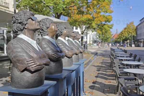 Unity sculpture - Persil remains Persil by Guido Messer 1993, modern art, five bronze sculptures looking up synchronously into the air, looking up, looking, pedestal, frame, sunglasses, crossed arms, row, series, cheerful, joy, curious, faces, tables, chairs, Friedrichstraße, Balingen, Swabian Alb, Baden-Württemberg, Germany