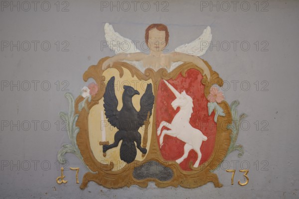 Relief of angel and coat of arms with eagle figure and unicorn, lion fountain built in 1773, year, two, painting, detail, Münsterplatz, Schwäbisch Gmünd, Baden-Württemberg, Germany