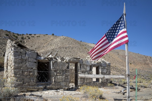 Austin, Nevada - A flag flies beside the ruins of the Walters station on the Nevada Central Railroad. The NCRR was a narrow gauge railroad opened in 1880 during a silver mining boom