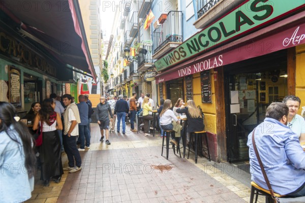 People outside tapas bars in El Tubo area of the Old Town, Zaragoza, Aragon, Spain