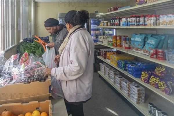 Detroit, Michigan USA - 4 November 2025 - People pick up groceries at the nonprofit Deo Gratias Food Pantry, operated by theFelician Sisters. Demand for emergency food at food pantries and soup kitchens has risen dramatically since the federal government shutdown cut SNAP benefits