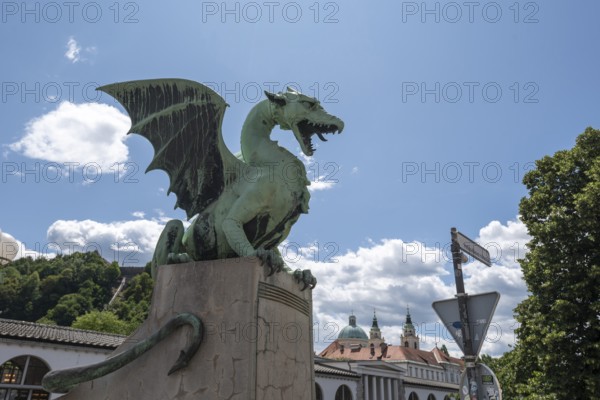 Green dragon statue on Dragon Bridge (Zmajski Most) in Ljubljana, Slovenia