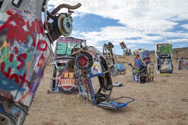 Goldfield, Nevada - The International Car Forest of the Last Church. Artist Mark Rippie has partially buried or decorated several dozen junk cars